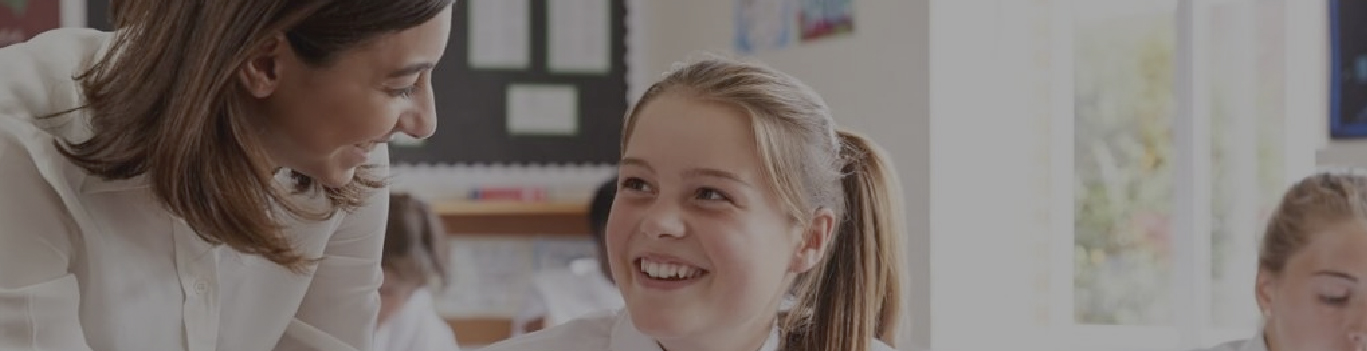 Rear view of kids raising hands while teacher explaining the fun